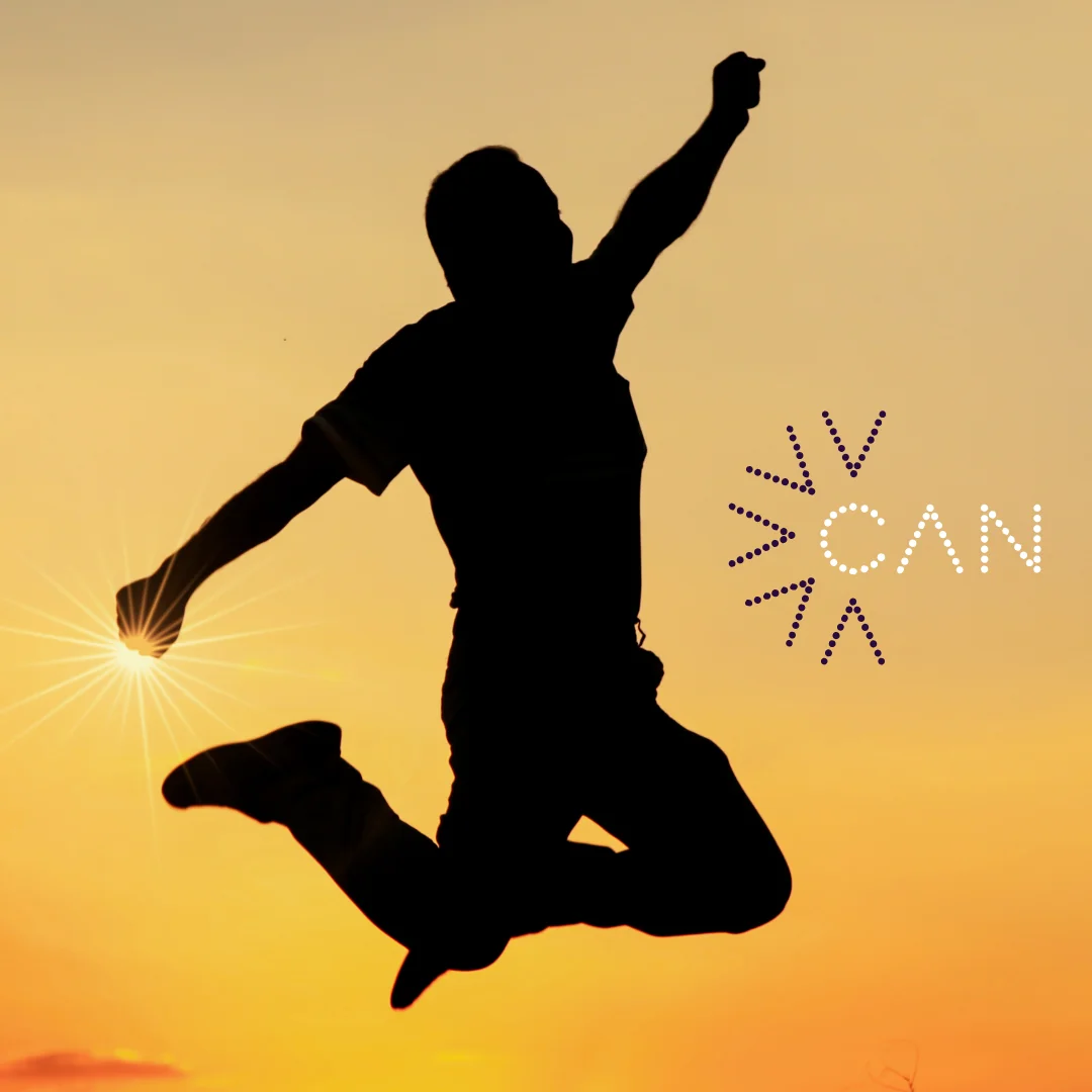 Young person jumping at sunset with the CAN logo