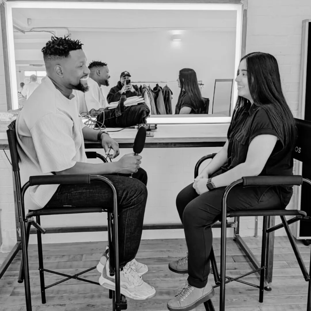 A youth worker in conversation with a young person at a delivery partner's space